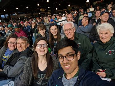 Curtis and family at a Mariners game.